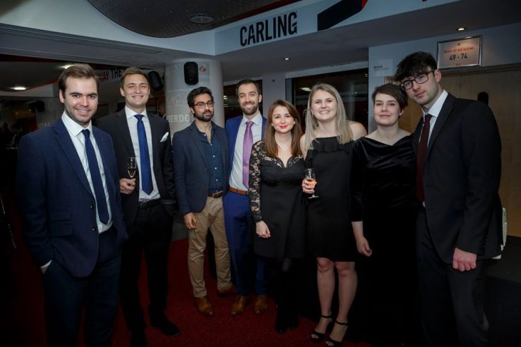 News Associates staff and trainees at the NCTJ Awards for Excellence in Sunderland in 2019. The selection of eight trainees, staff and guests are all very smartly dressed.