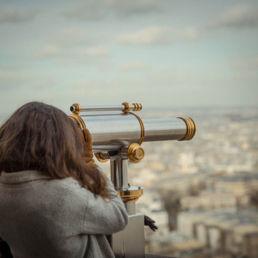 Stock image of a woman with a telescope
