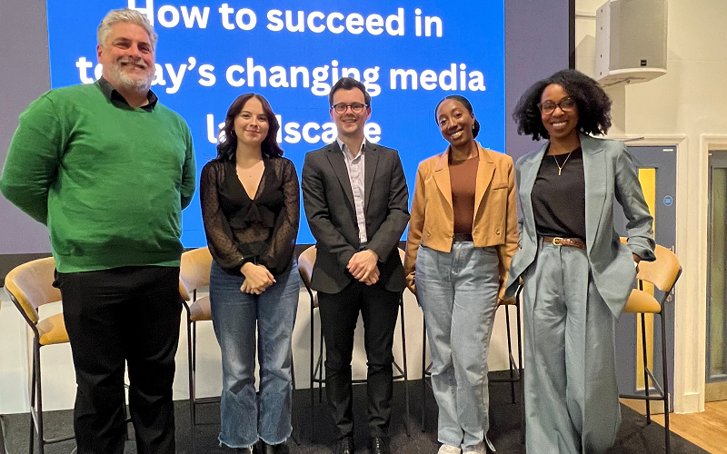 Our 'how to succeed in today's changing media landscape' panellists, from left to right, Dominic Ponsford, Eve Bennett, James Smith, Manuela Brown and Jacqueline Shepherd at JournoFest 2024. They are all standing and smiling for the camera.