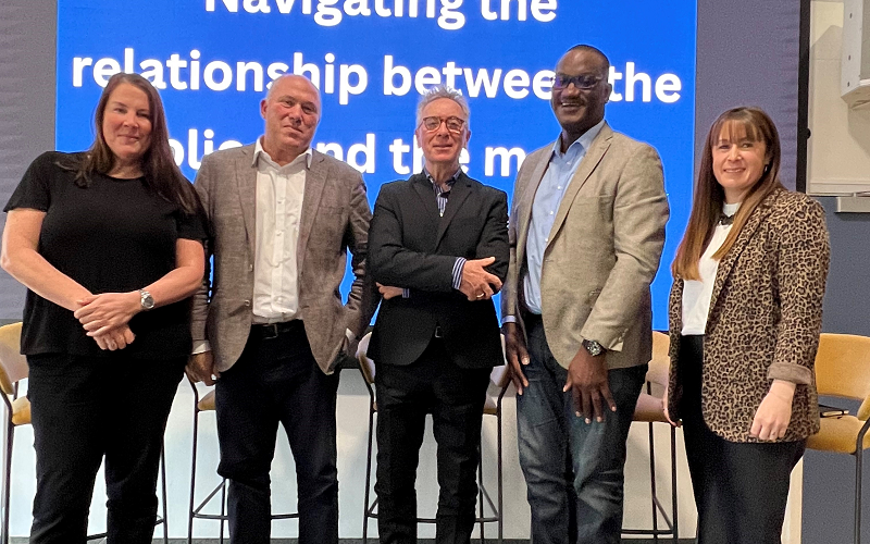 Our 'navigating the relationship between the police and the media' panel at JournoFest 2024. From left to right, Pippa Mills, Mike Sullivan, Martin Brunt. Anthony France and Vicky O'Hare. They are all standing, smartly dressed and smiling for the camera.