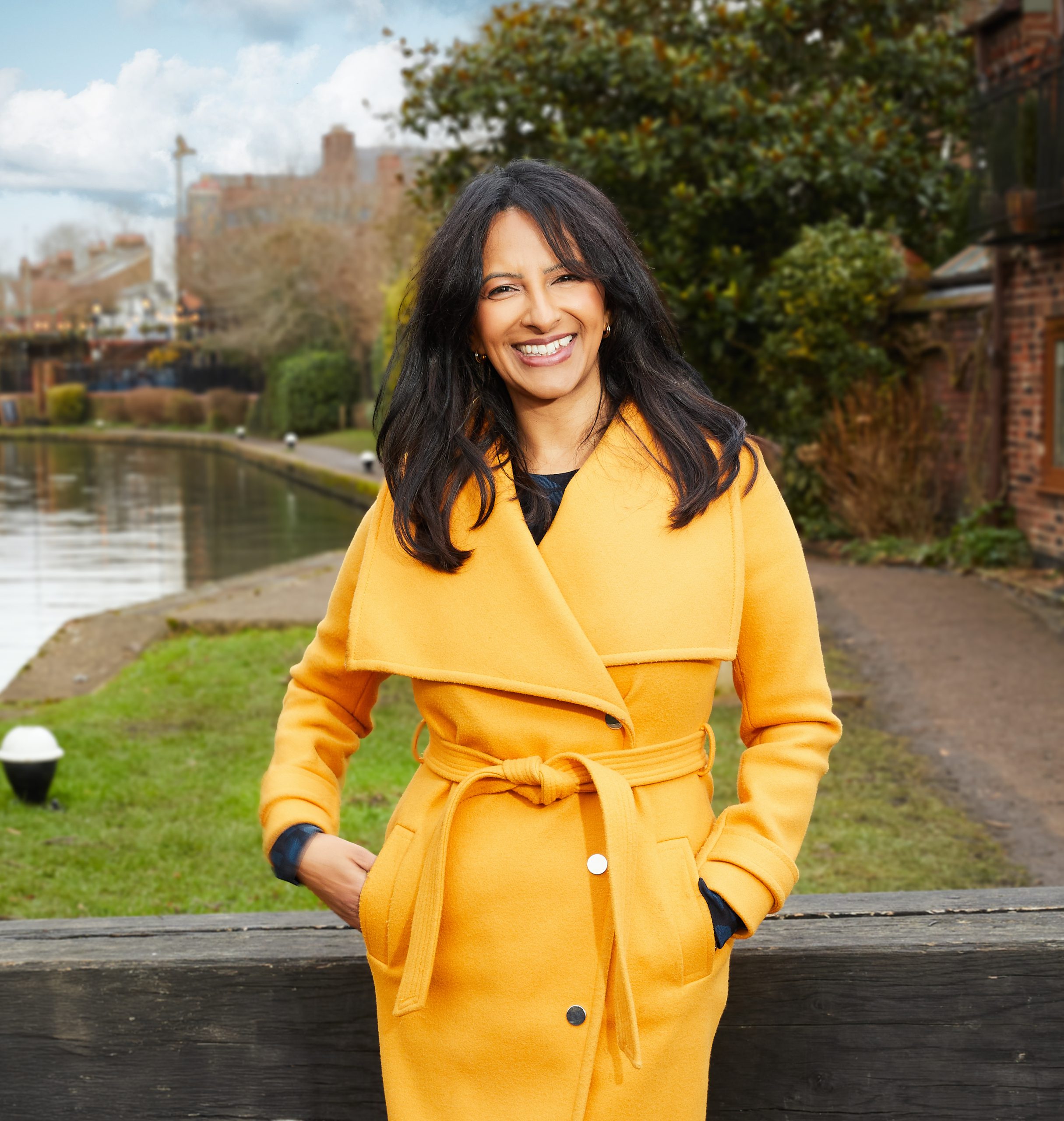 An image of JournoFest speaker Ranvir Singh standing outside in a lovely yellow coat.