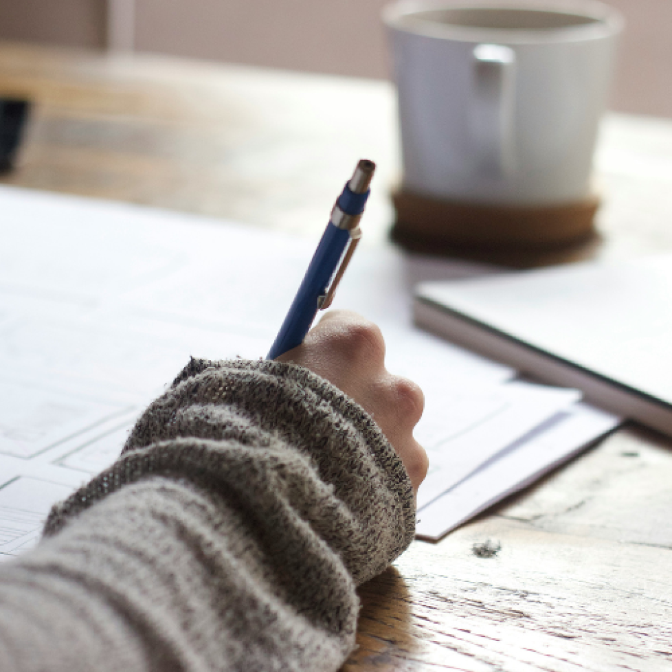 A photo of someone studying at a desk. We are using this image to illustrate our article, 'getting back into education'.
