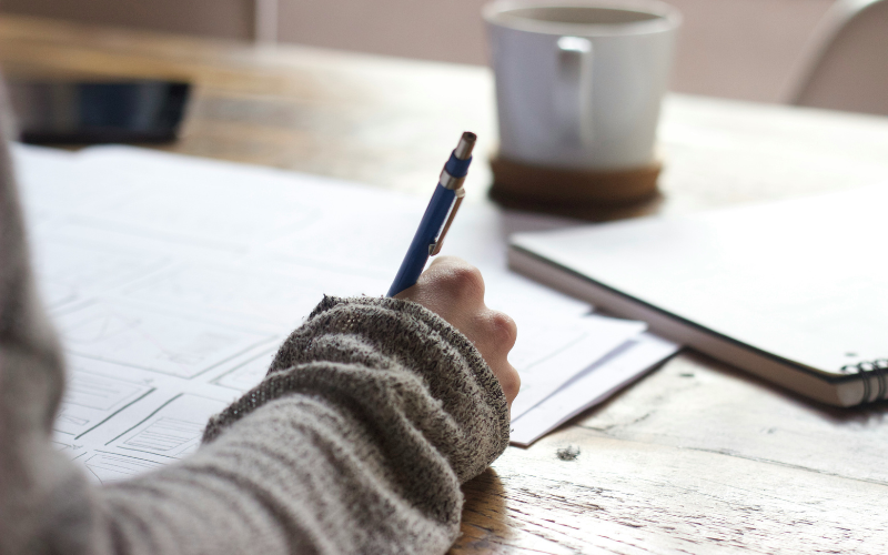 A photo of someone studying at a desk. We are using this image to illustrate our article, 'getting back into education'.